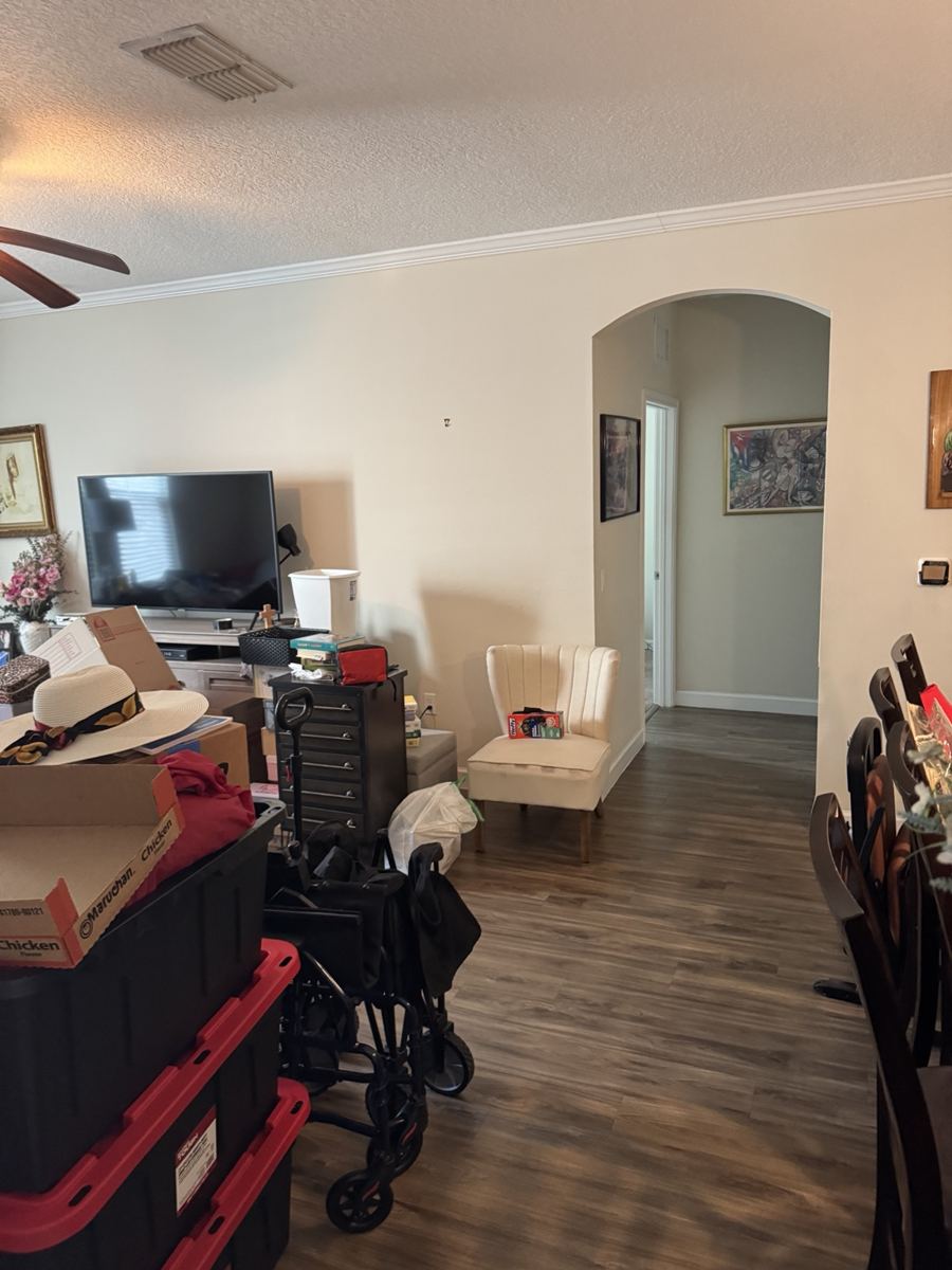 Living and dining area contents ready for removal.